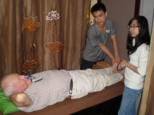 BLIND STUDENT PRACTICES MASSAGE WITH VOLUNTEER DON MAHER