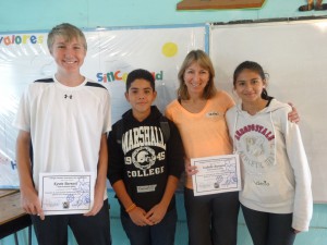 Kevin Barnard and Isabelle Barnard with certificates and students