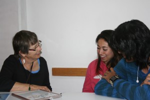 Priscilla working with two students