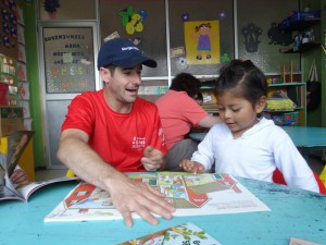 Leonardo,  the child reading here with volunteer Martin,  speaks Quechua at home