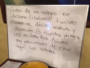 White board during lesson on basic Spanish pleasantries for volunteers upon arrival in country