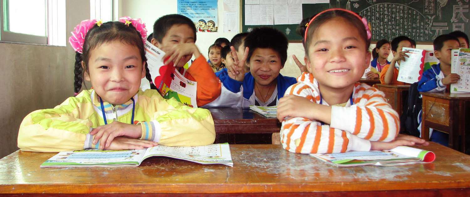 Volunteers teach English to students in China