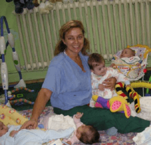Tracy volunteering with babies in Romania