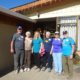 Team of five volunteers plus team leader outside bed and breakfast in Monteverde, Costa Rica