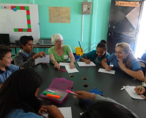 Costa Rica volunteer Barb in conversational English class with students