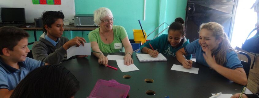 Costa Rica volunteer Barb in conversational English class with students