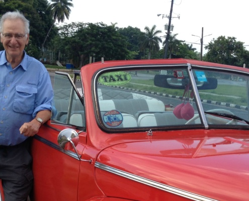 Cuba volunteer with vintage car