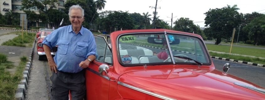 Cuba volunteer with vintage car