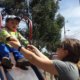 Global Volunteer Alyssa Peiffer helping child on slide in Ecuador