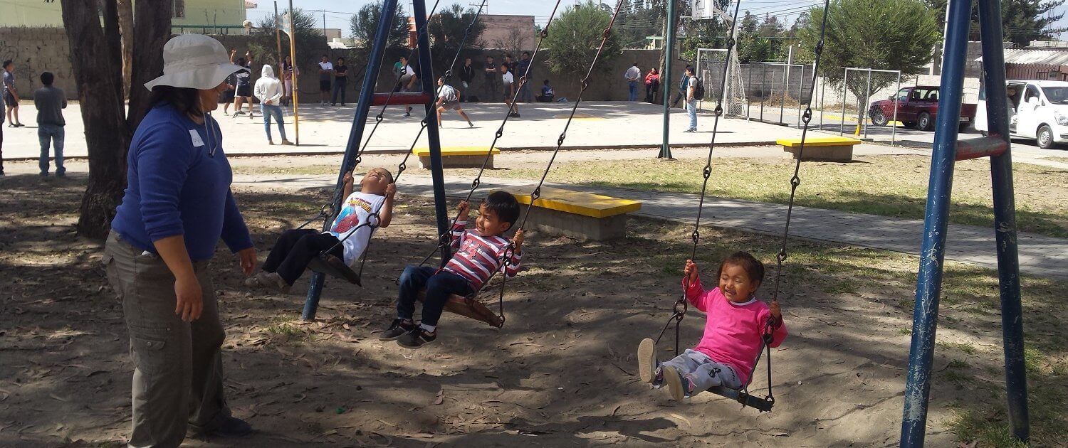 at the park working with children in Quito