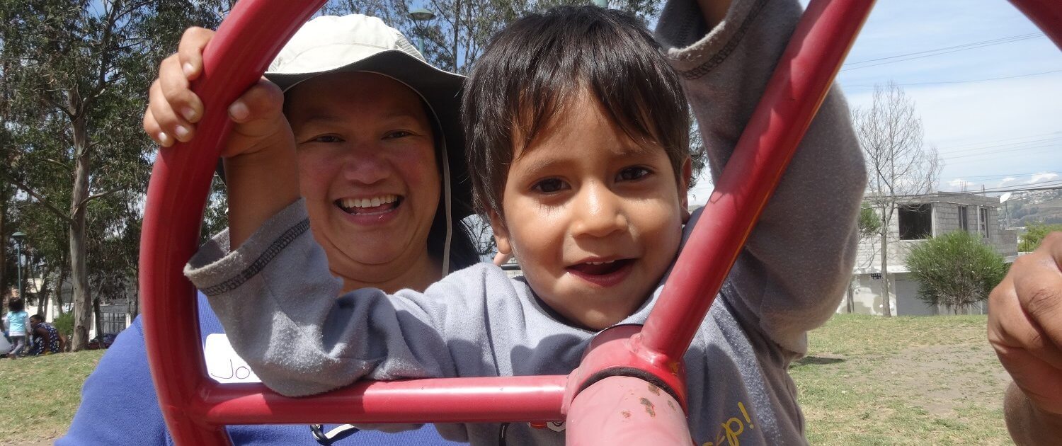 Joyce caring for children in Ecuador