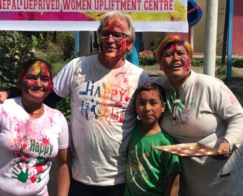 Volunteer, teacher and students celebrate Holi festival in Nepal