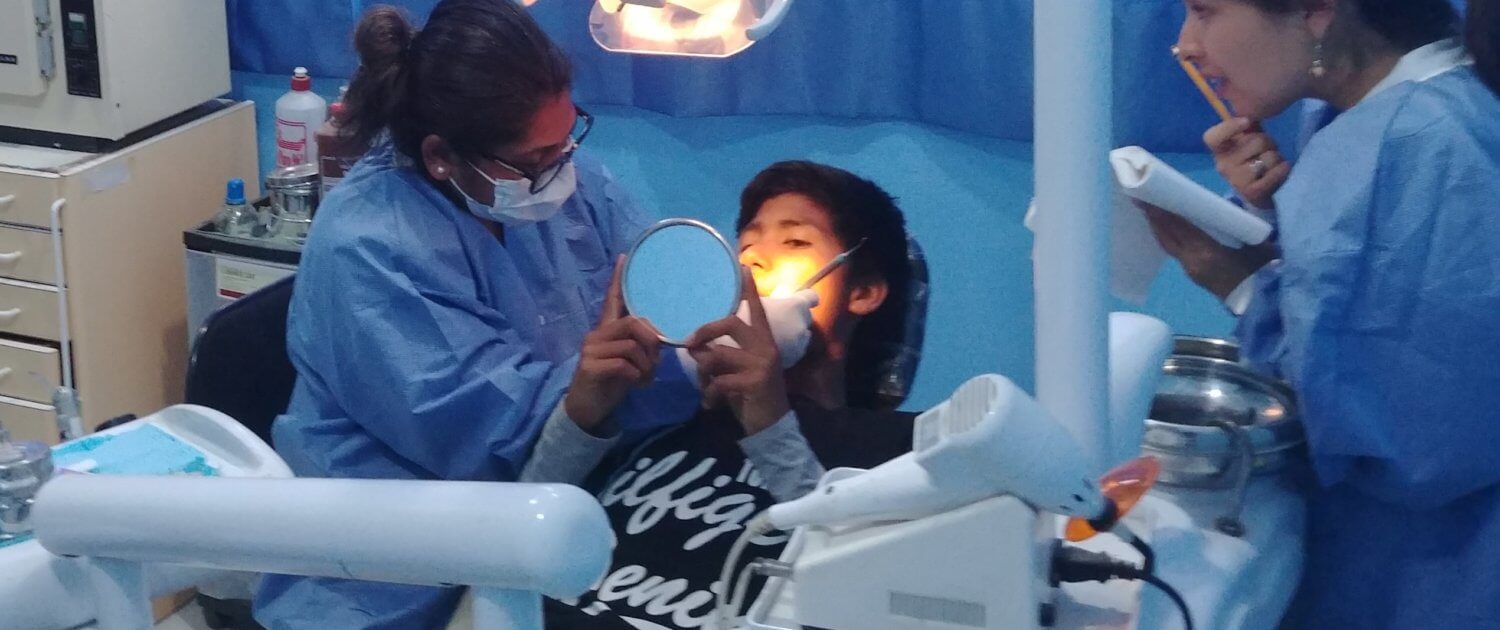 Volunteer Chetna Rana provides dental care to the children