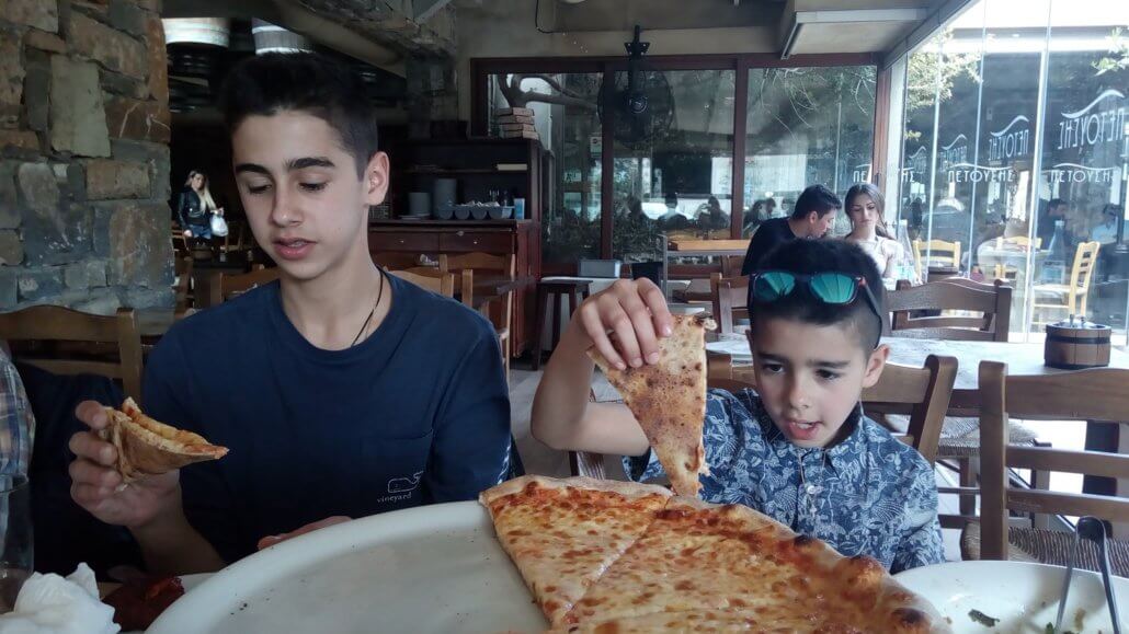 Rowhan and Shaan loving Greek pizza