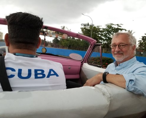 Peter enjoys the ride in one of Havana's classic cars, a 1954 Chevy