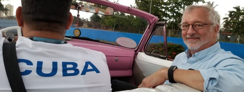 Peter enjoys the ride in one of Havana's classic cars, a 1954 Chevy