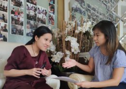 Volunteer converses with visually impaired student in Vietnam