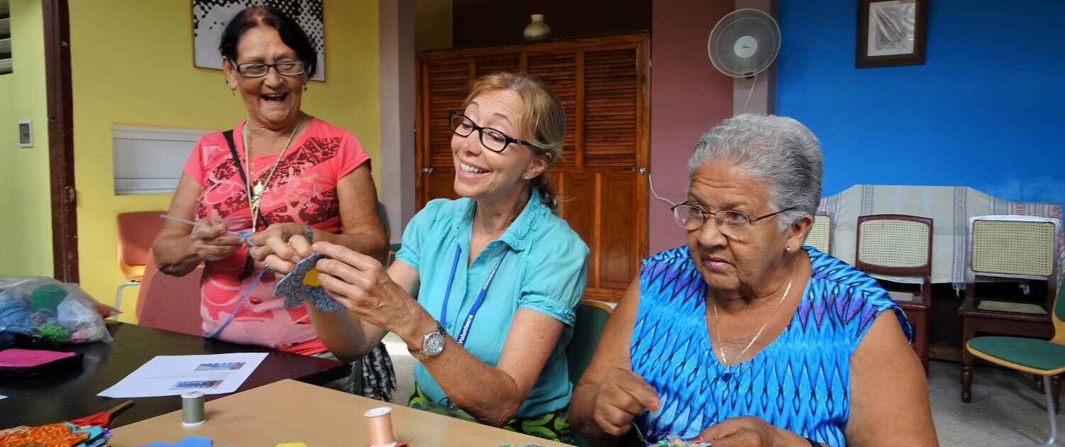 Volunteer abroad works with ladies at a sewing circle in Ciego de Avila, Cuba.
