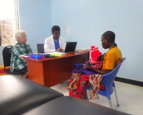 volunteer Procerfina Kebabian working with the doctor at the clinic tanzania