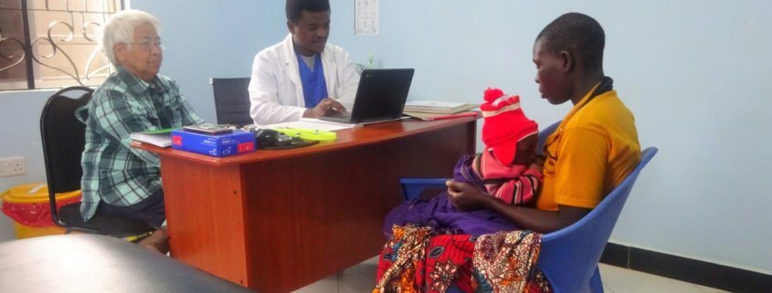 volunteer Procerfina Kebabian working with the doctor at the clinic tanzania