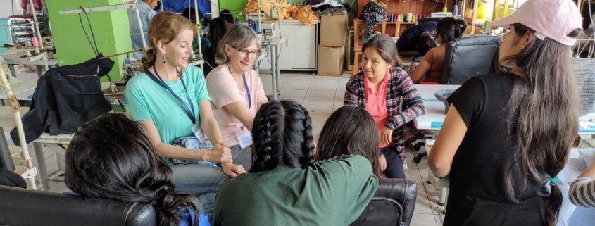 volunteers talk to girls in Peru