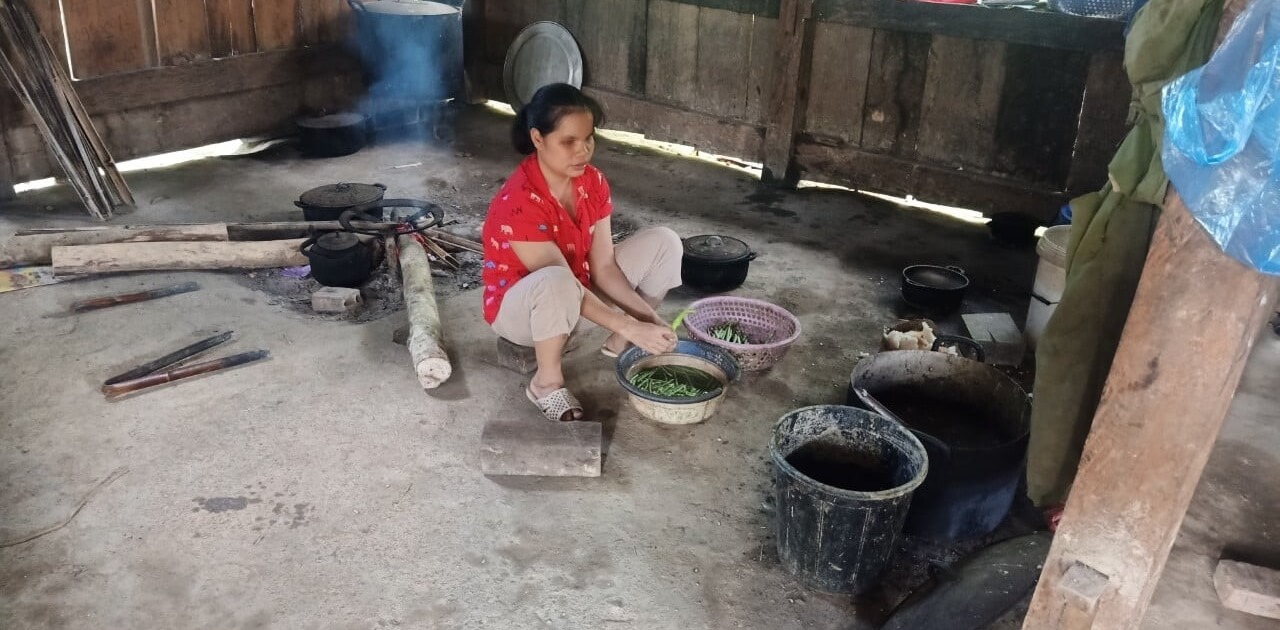 Hue helps her family cook at her home in vietnam