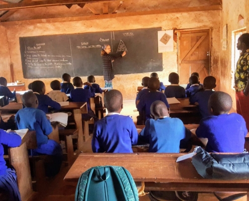 Volunteer teaches at a primary school in Mkalanga, Tanzania.