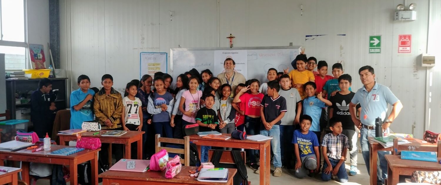 international abroad Volunteer teaching English to an elementary school class at Sagrada Familia in Lima, Peru.  