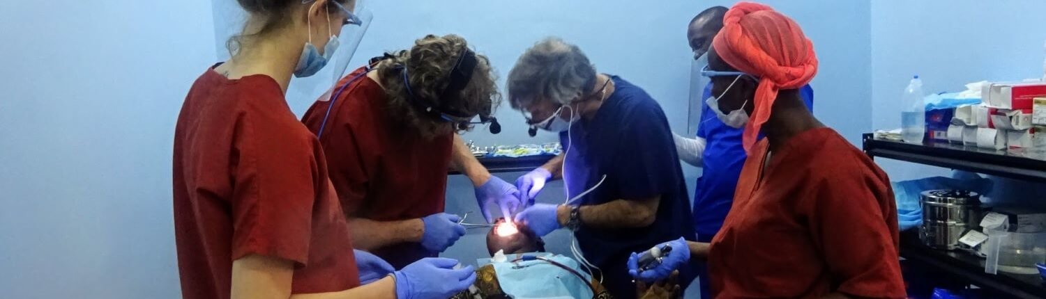 Volunteers Bryan and Maddy Aungst, and Nelson Goodman providing dental care with local staff in Tanzania.