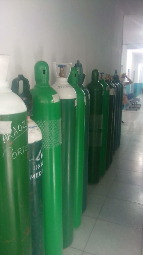 Oxygen tanks are lined up at the clinic peru