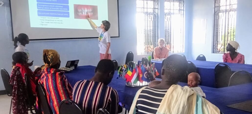 Volunteer Christine Edner conducted a workshop on dental health for RCP moms in Tanzania.
