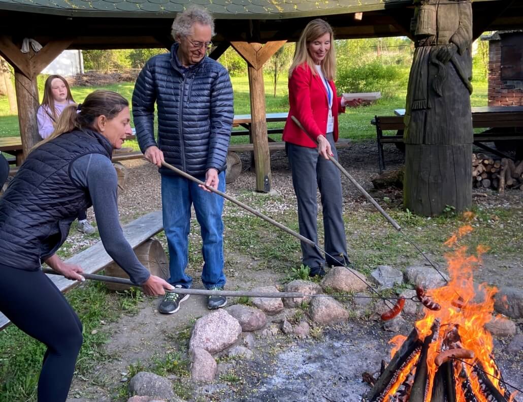 Volunteers host an evening bonfire with Ukrainian refugees in Poland.