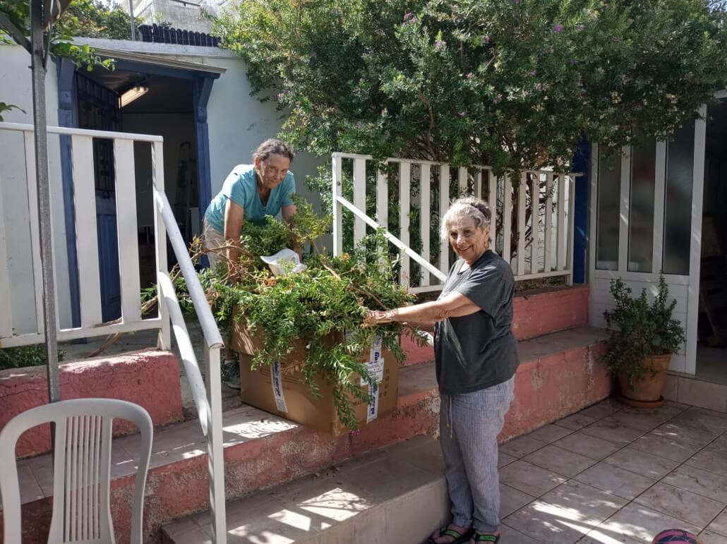 Wilma (R) & Marty cleaning the garden at the shelter for abused women and children