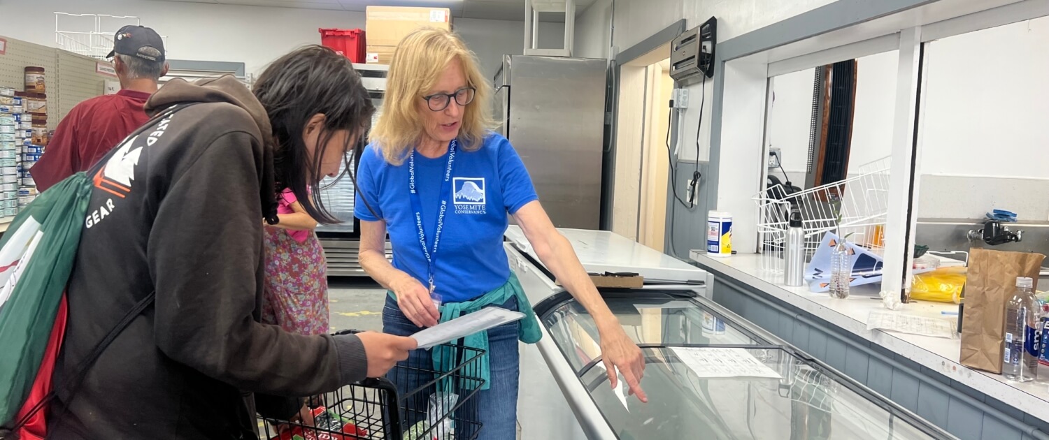 Volunteer Nancy Felderspiel with local person at FAST