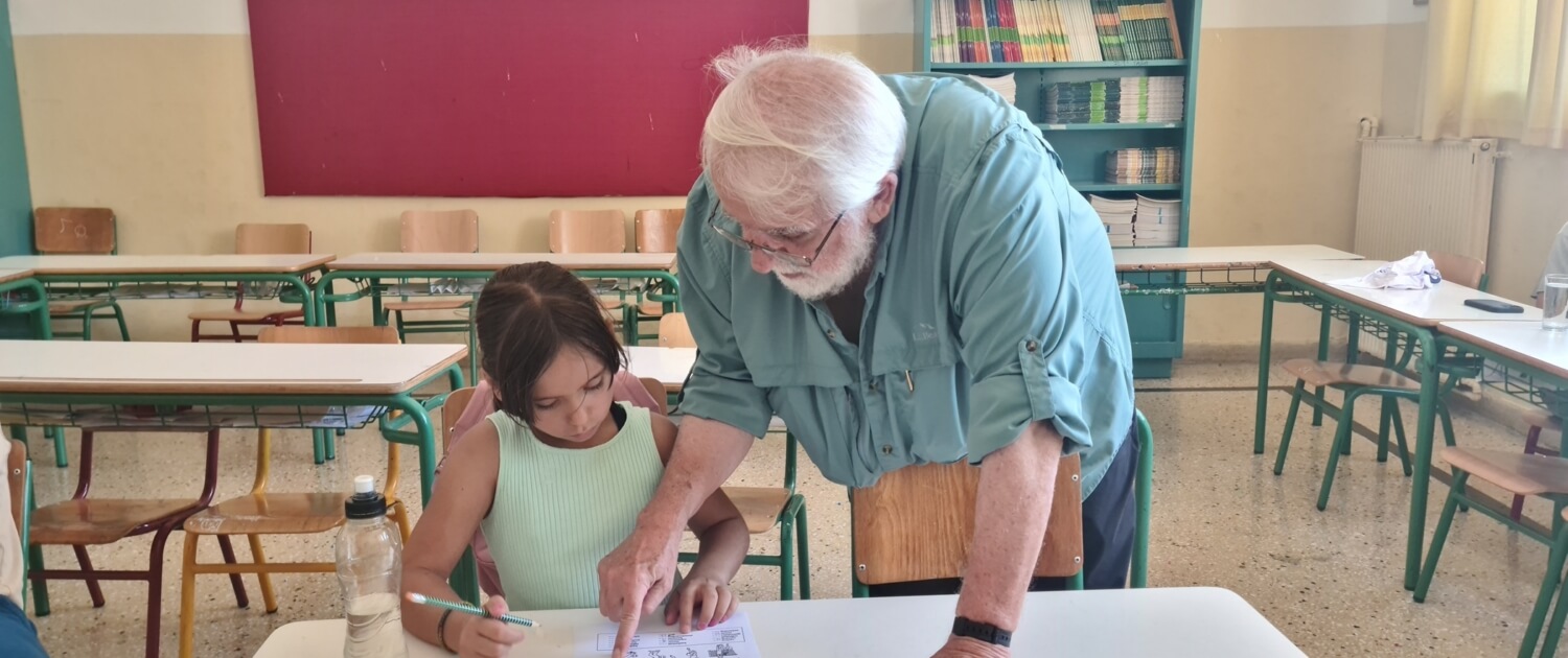 Tom Monahan teaching conversational English as a volunteer in Greece