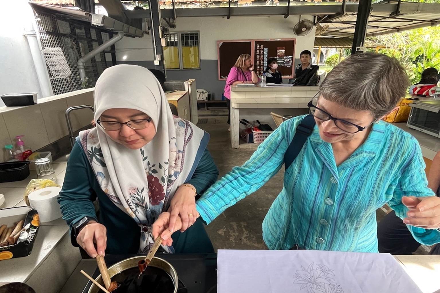 Evan Boido doing batik with local