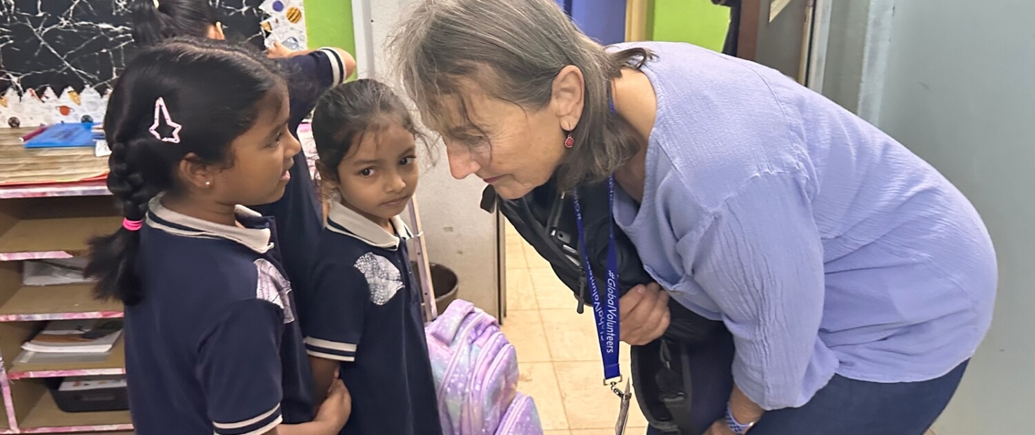 MAL2601A1 Rae Clausen bonding with young students at Sri Ari